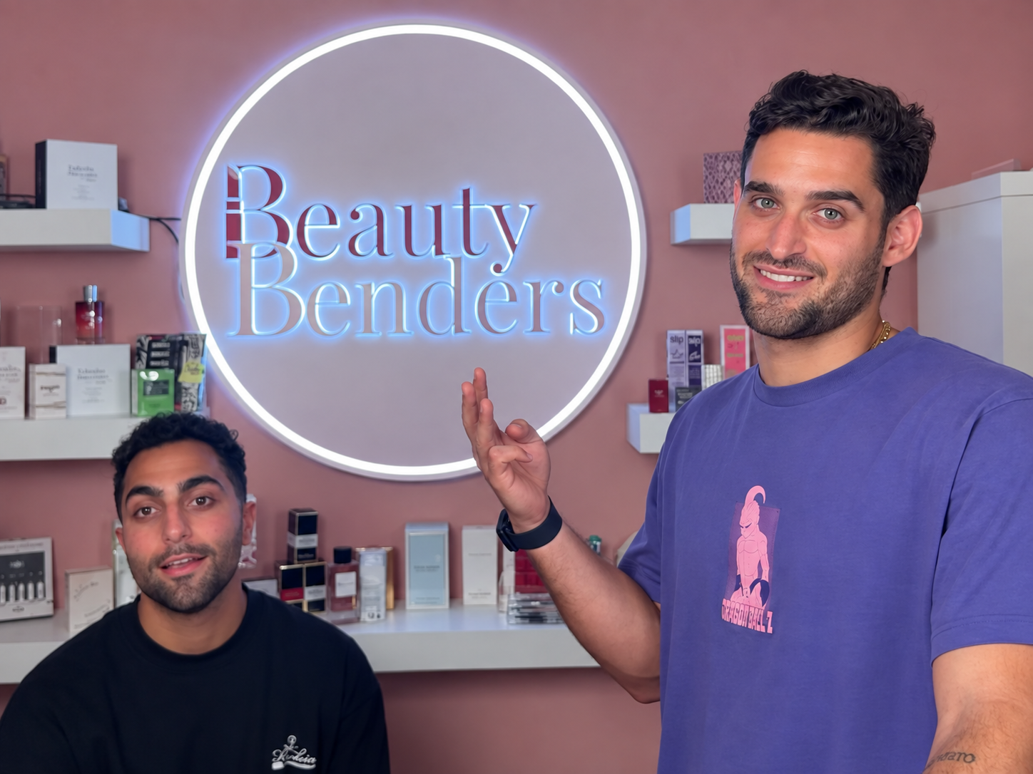 The Beauty Benders team under the Beauty Benders sign